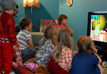 Children watching FABULERA MERA at the exhibition.